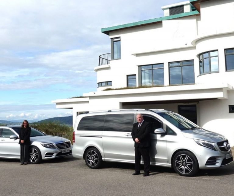 Prestige Chauffeur vehicles and drivers outside a building