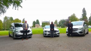Prestige chauffeurs beside Mercedes cars outside Culloden House