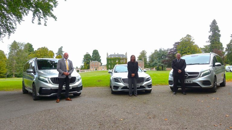 Prestige chauffeurs beside Mercedes cars outside Culloden House